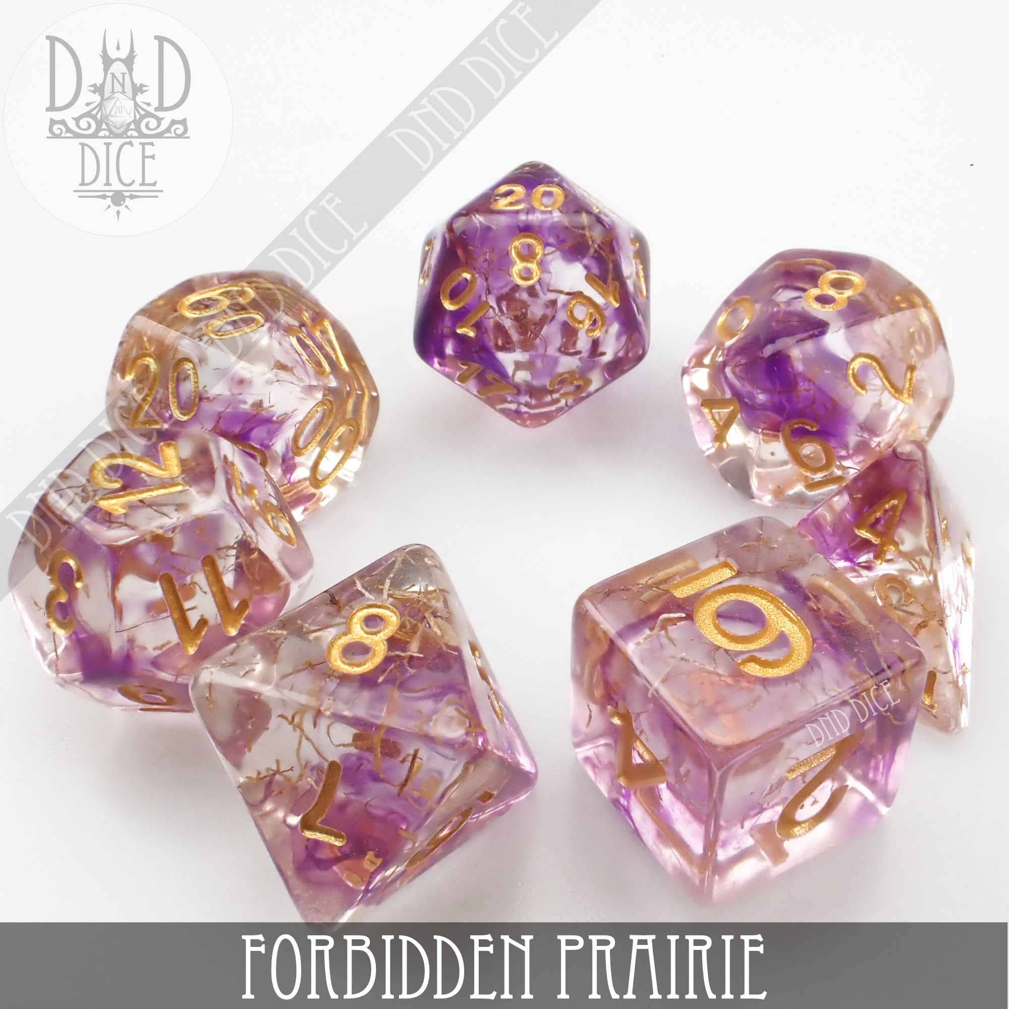 Forbidden Prairie 7-dice set, clear resin with purple and gold sparkles, gold numbers.