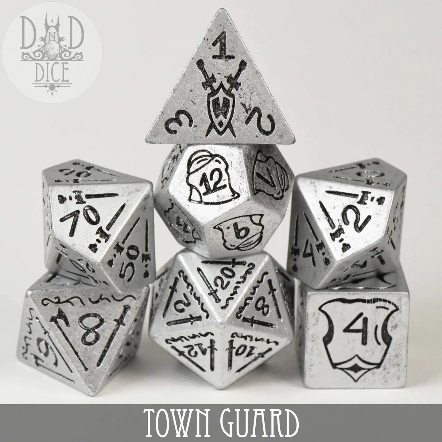 Town Guard Dice Set with silver polyhedral dice and black markings displayed in a pyramid arrangement.