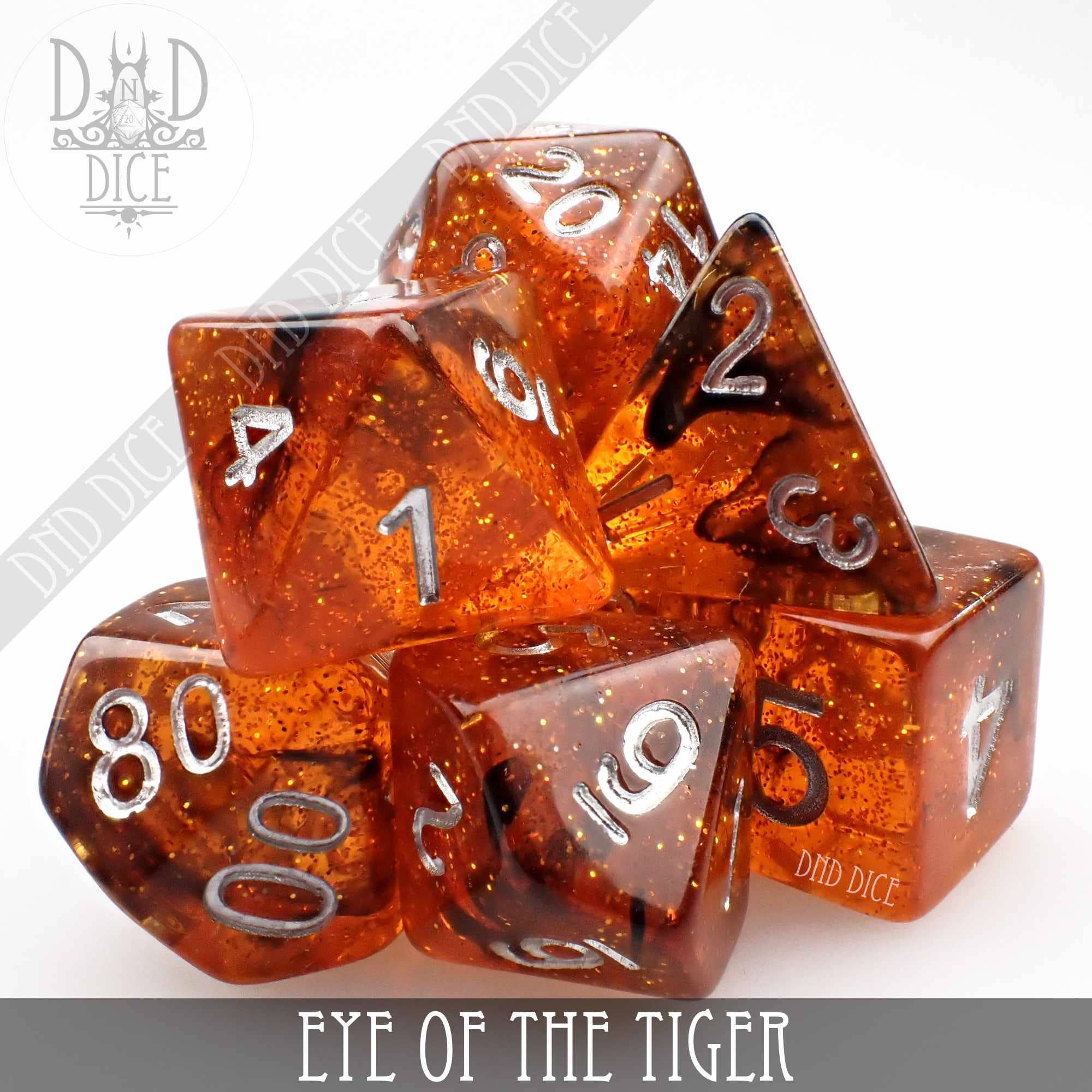 Eye of the Tiger orange glitter resin dice set with white numbers, 7 pieces.