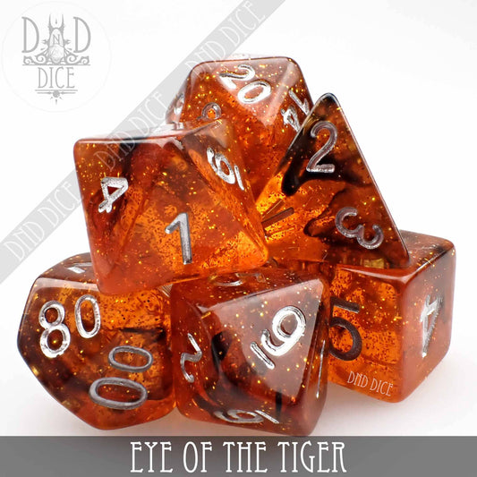 Eye of the Tiger orange glitter resin dice set with white numbers, 7 pieces.