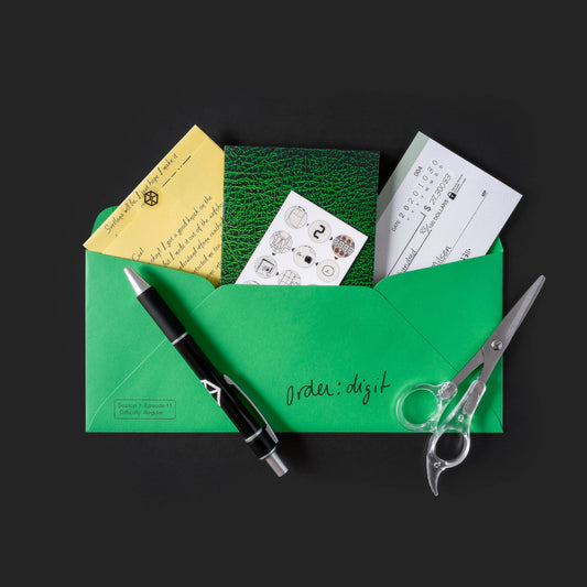 Green envelope with yellow note, green card, and check from Family Secrets Series: Episode 11.