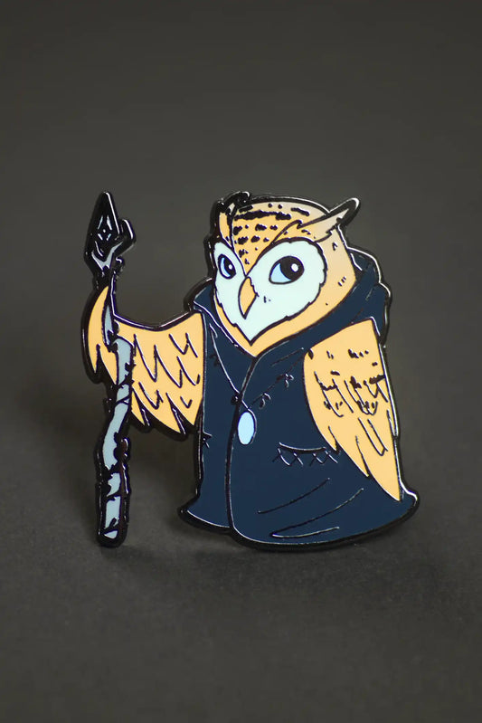 Enamel pin pack featuring a cartoon owl in a cloak holding a staff.