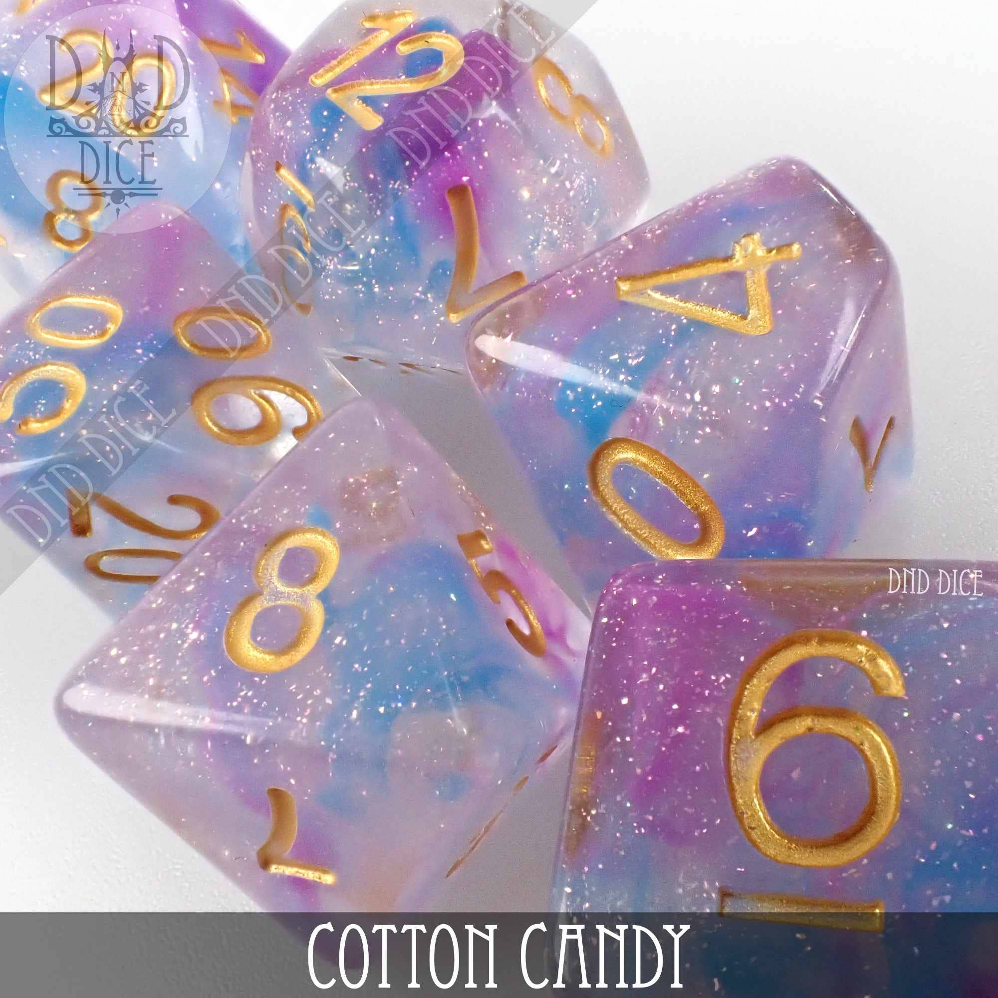 Cotton Candy 7-piece resin dice set in glittery pink, purple, and blue with gold numbers.