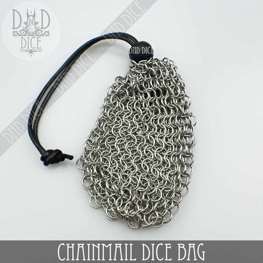 Chainmail bag with black drawstring and stainless steel dice box on white background.