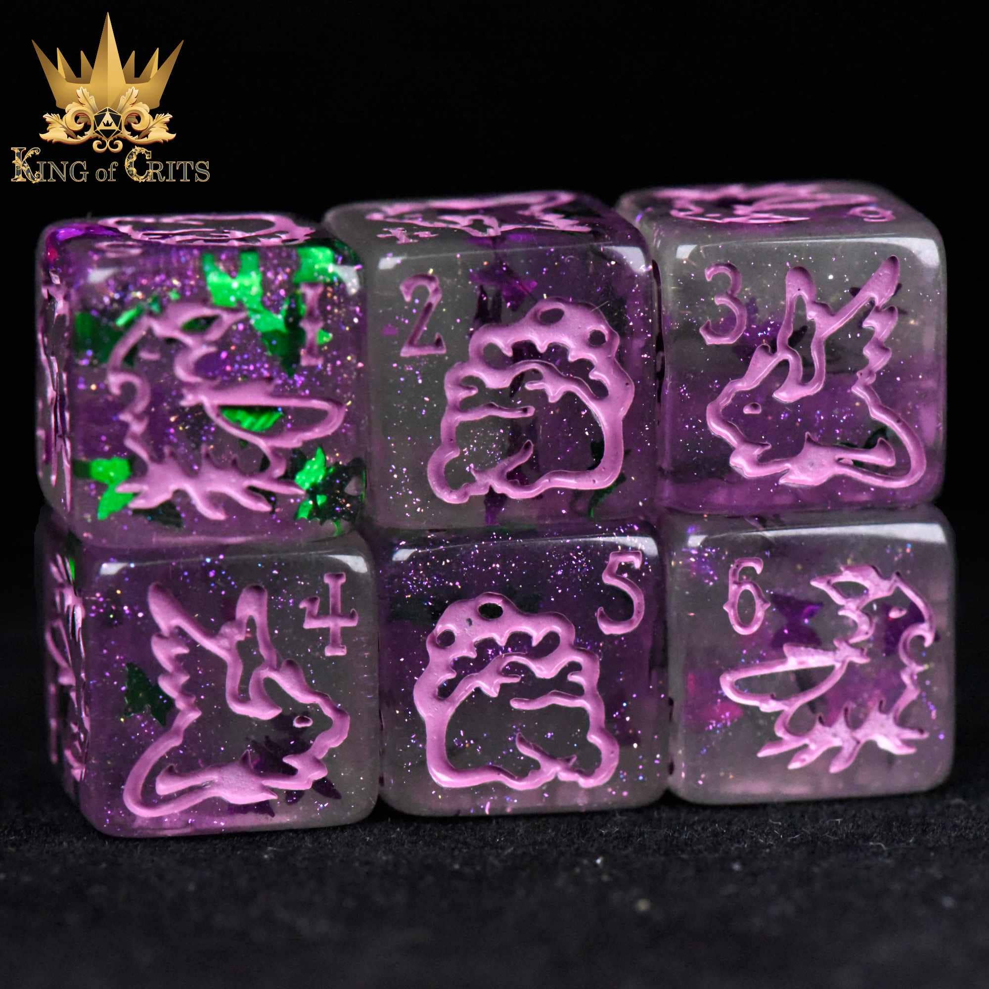 Fairy Flight set of eleven glittery translucent butterfly dice with pink dragon details and King of Crits logo.