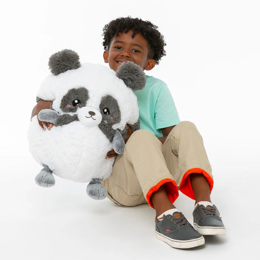 Baby Panda III Squishable (15) toy held by a smiling child.