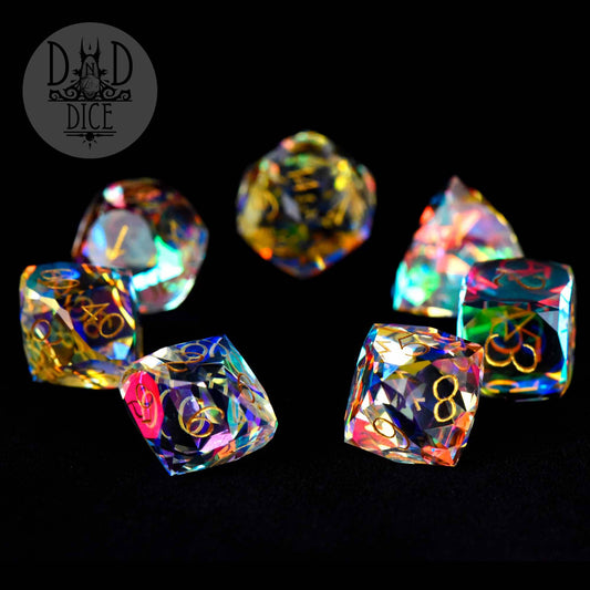 Gem Cut Prism Dice Set: colorful translucent dice with gold numbers and DnD Dice logo, gift box variant.