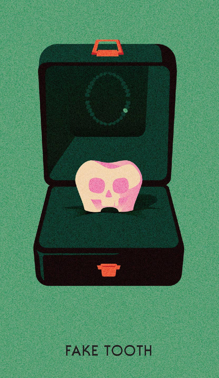 Murdle Oracle Deck or murder mystery cards partially visible beneath an open box containing a skull-tooth.