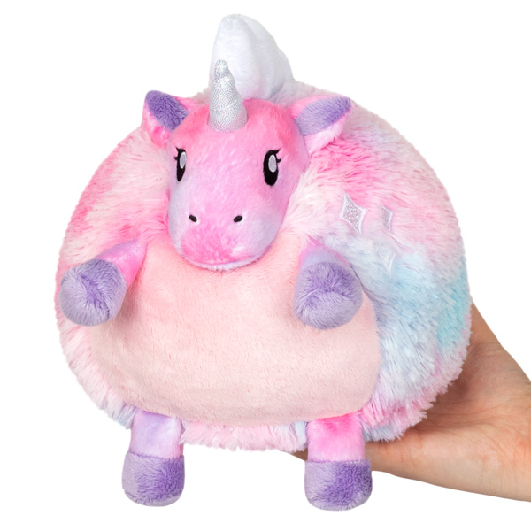 Cotton Candy Baby Unicorn Mini Squishable plush with pastel colors, white horn, and purple accents held in a hand.