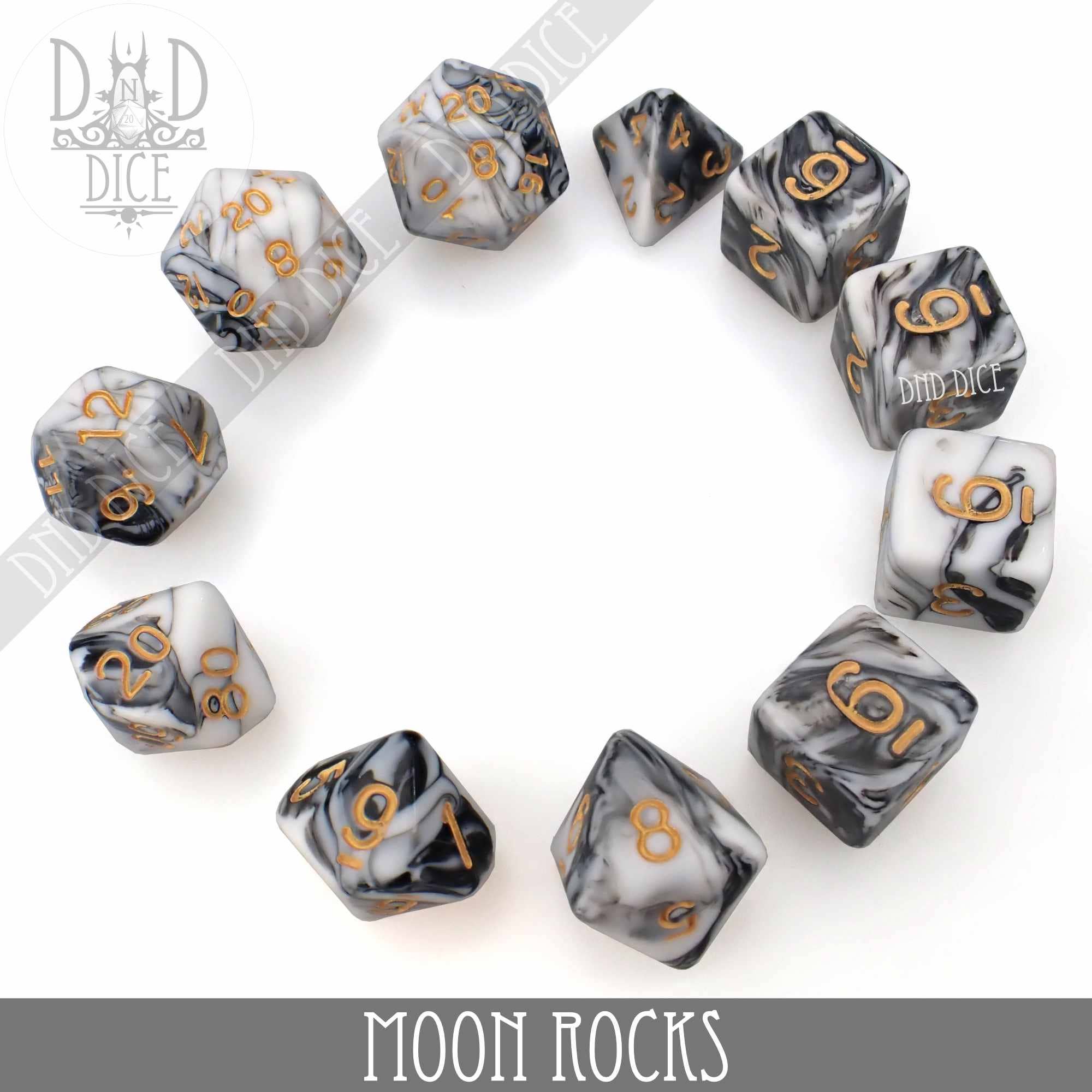 Moon Rocks 7 or 11 polyhedral dice set, marbled black, white, and gray with gold numbers, in packaging.