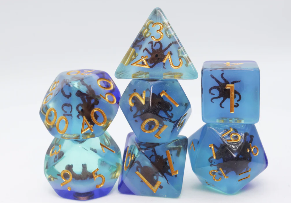 Coffee Octopus RPG Dice Set with blue and teal polyhedral dice, gold numbers, and small octopus figures.