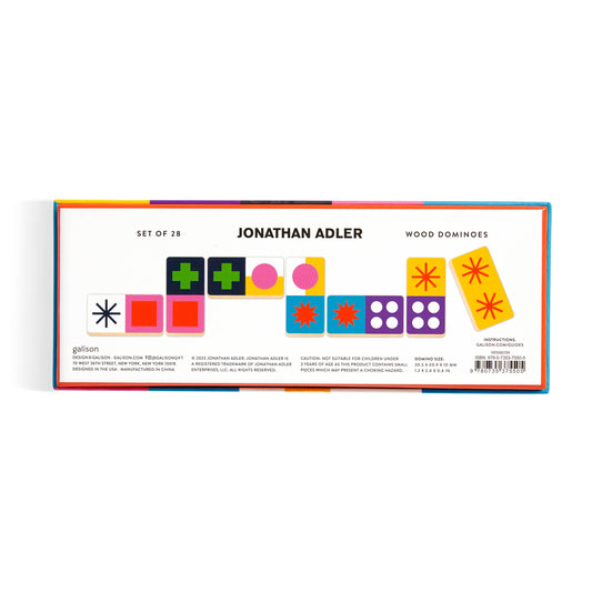Jonathan Adler Helsinki Wood Domino Set with wood dominoes in a colorful box featuring geometric and star patterns.