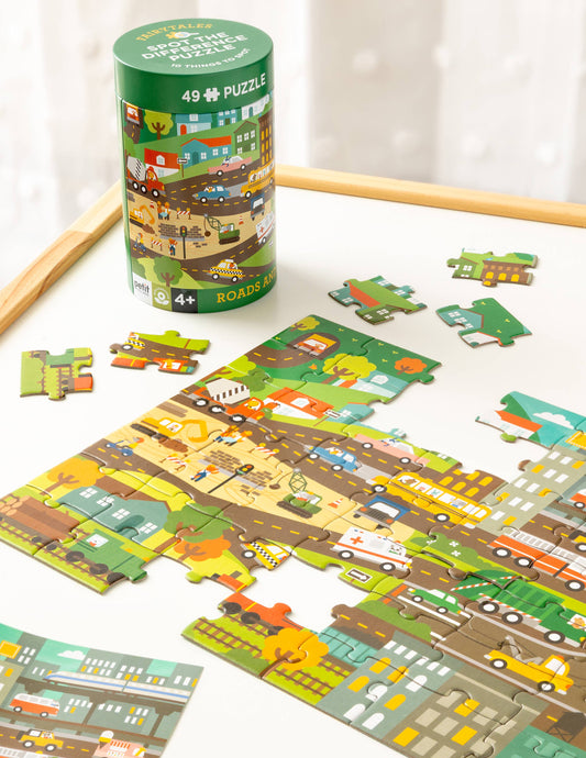 Spot the Difference Puzzle: Roads and Rails city roads theme jigsaw, partially assembled with box nearby.