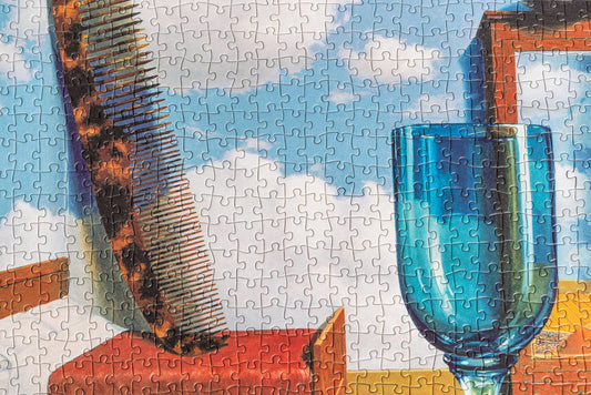Puzzle - René Magritte - Personal Values, showing blue glass, brown comb, books, and cloudy sky elements.