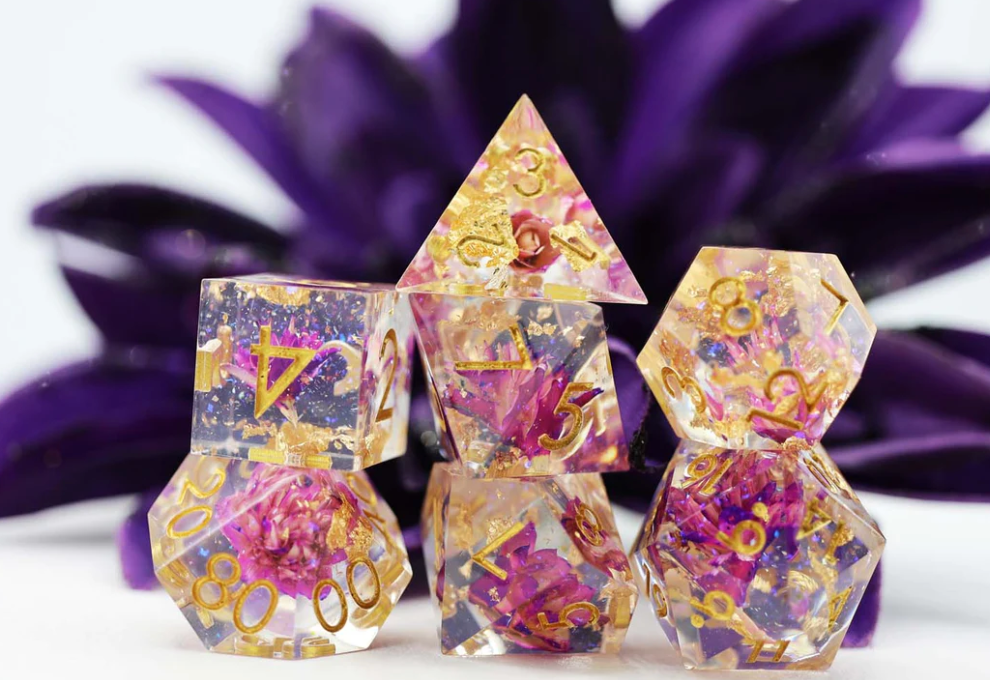 Sharp Edge Resin RPG Dice Set Purple Lotus with gold numbers and purple lotus flowers.
