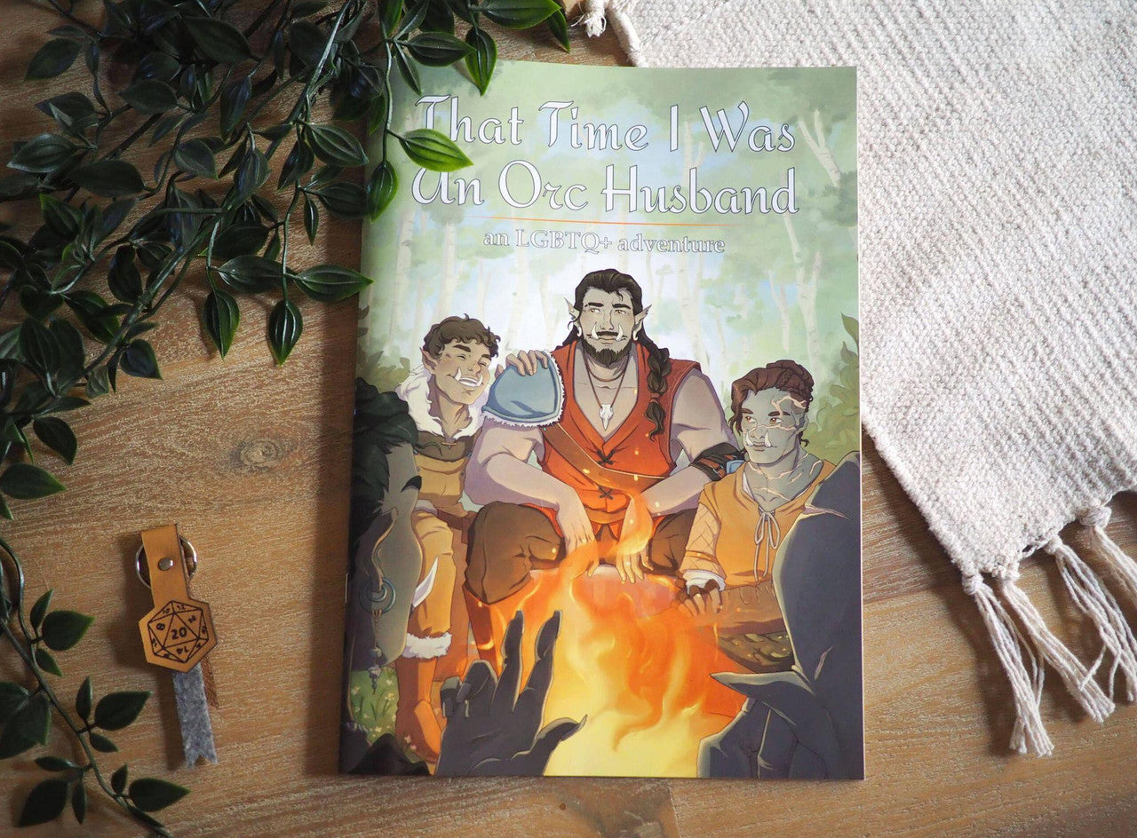 That Time I Was an Orc Husband queer adventure book cover with illustrated characters by a campfire.