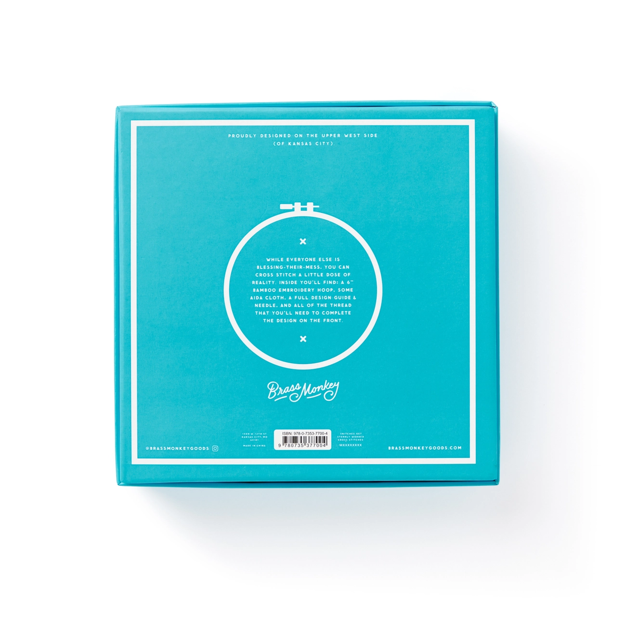 Live Laugh Loathe Cross Stitch Kit in blue box with white text, branding, and embroidery hoop graphic.