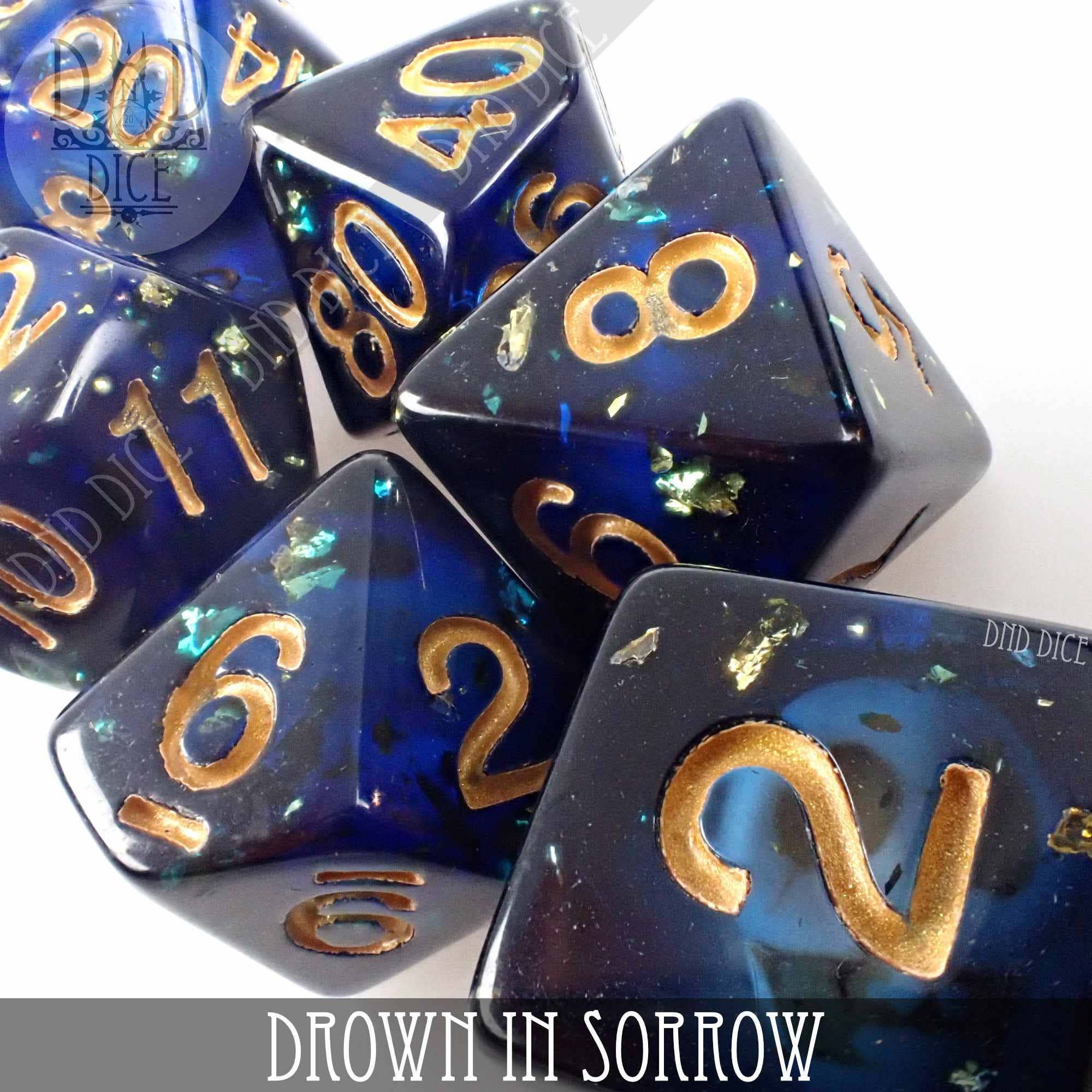 Drown in Sorrow blue resin dice set with gold numbers for tabletop gaming.