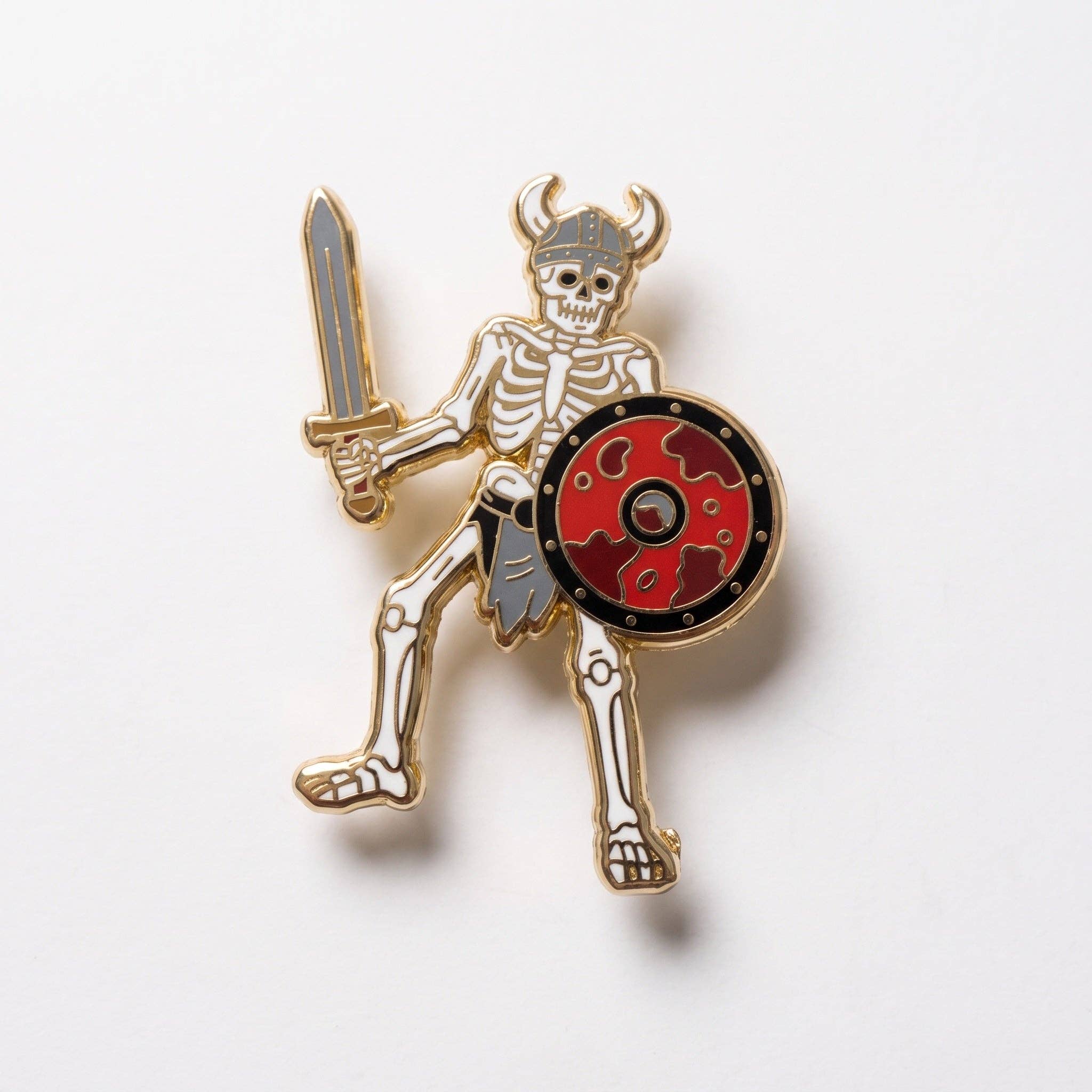 Berserker pin: skeleton warrior in a horned helmet with sword, round shield, and locking clasp.