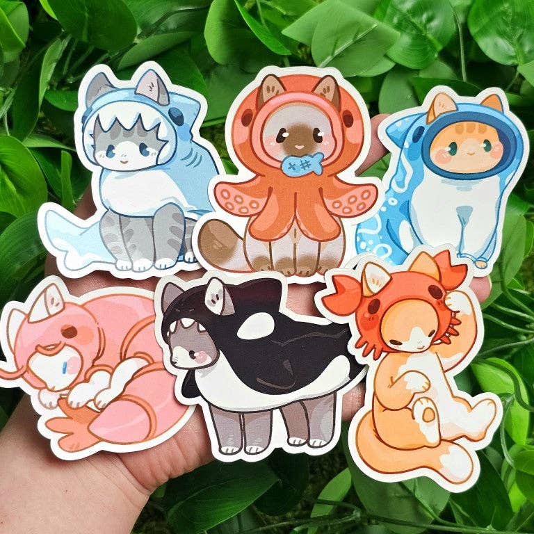 Six cat stickers in sea creature costumes.
