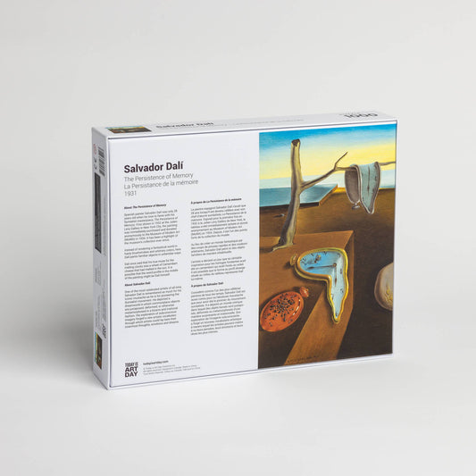 Back of Salvador Dali Persistence of Memory puzzle box with text in three languages.