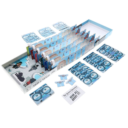 It Flies, It Spies family board game with cards, tokens, player screens, and comic-style newspapers included.