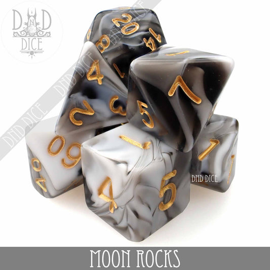 Moon Rocks 7 or 11 dice set: black, white, and gray marbled dice with gold numbers in a clear acrylic bottle.