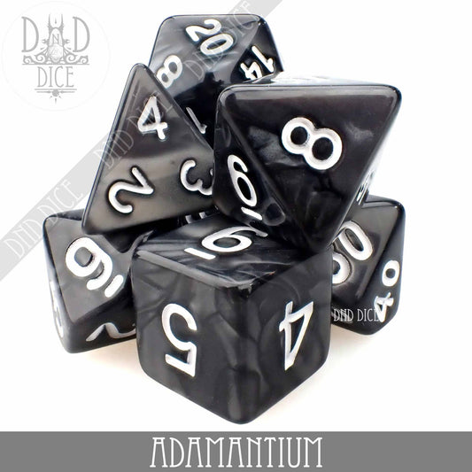 Black marbled acrylic dice with white numbers, labeled Adamantium 7 or 11.