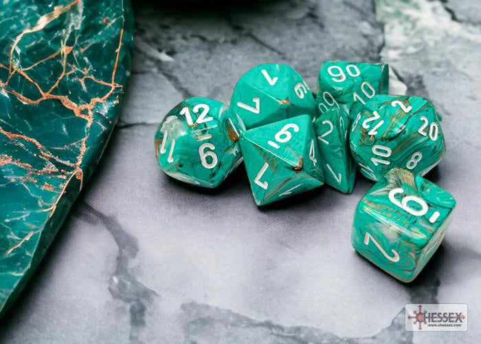 Chessex Marble Polyhedral Oxi-Copper/White 7-die set with white numbers next to a matching marbled stone.