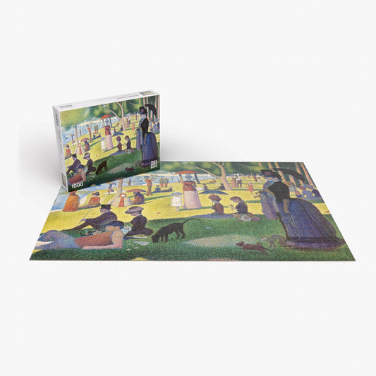 Georges Seurat Sunday Afternoon completed puzzle and box displaying the pointillist artwork.