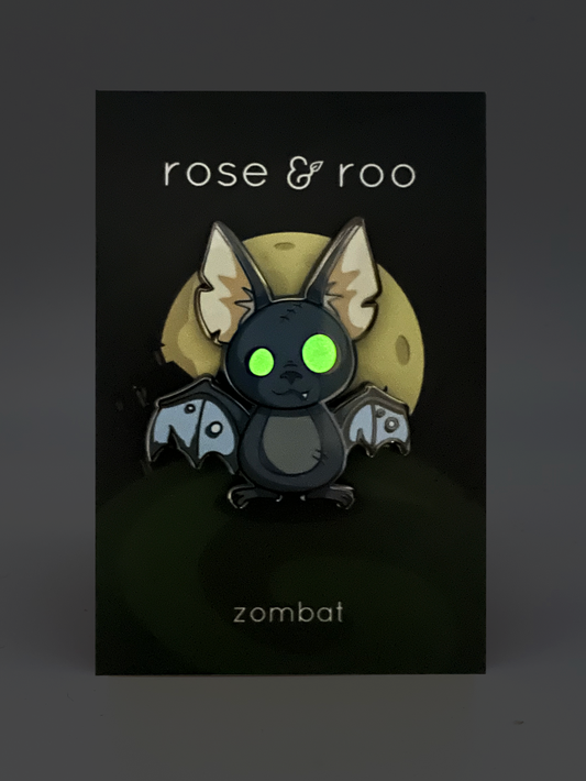 Zombat Bat Enamel Pin, glow-in-the-dark variant, on a card labeled rose & roo and zombat.