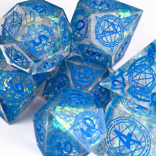 Crown of Magic (Handmade) 7-piece translucent blue resin dice set with iridescent flakes and arcane symbols.