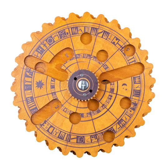 The Egyptian Almanac Mathematical Brainteaser with engraved symbols, rotating arms, and circular cutouts.