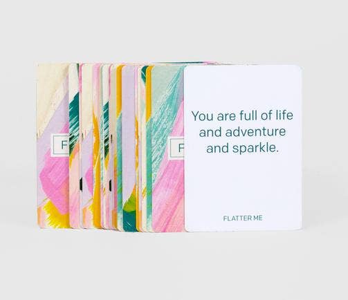 Flatter Me: A Compliment Battle Card Game cards with one card reading, You are full of life and adventure and sparkle.
