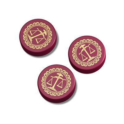 Three maroon tokens with gold scales of justice and a gavel for Love Letter (New Edition, Bag) card game.