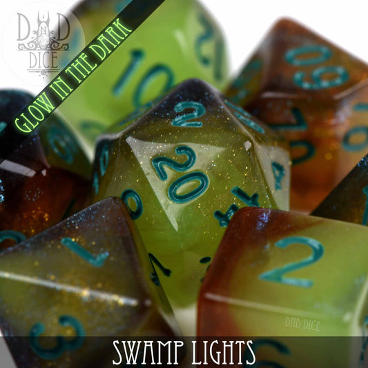 Swamp Lights Glow in the Dark DND resin dice set, green, brown, and yellow with teal numbers.