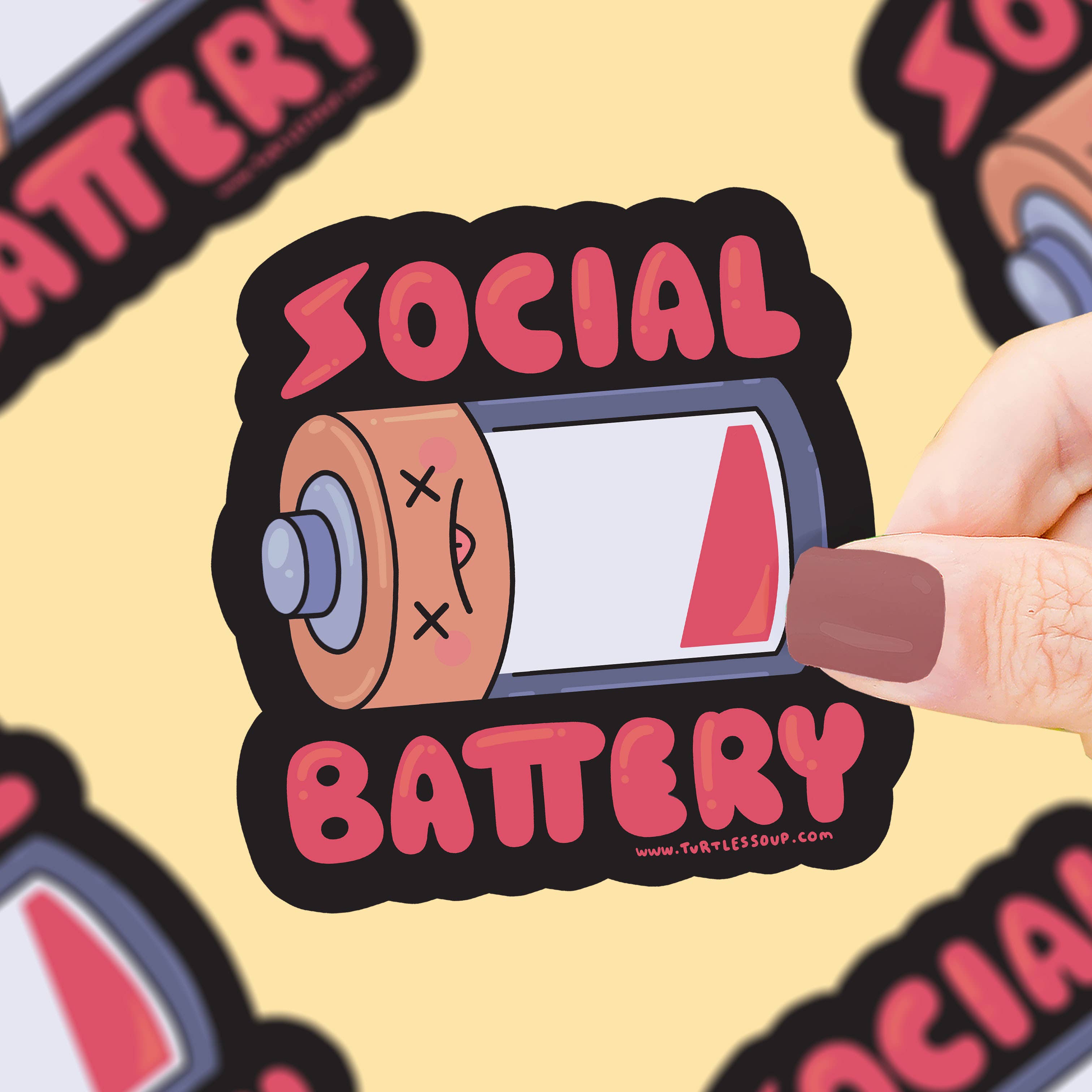 Social Battery Empty Introvert Vinyl Sticker with a low battery icon held in a hand against a yellow background.