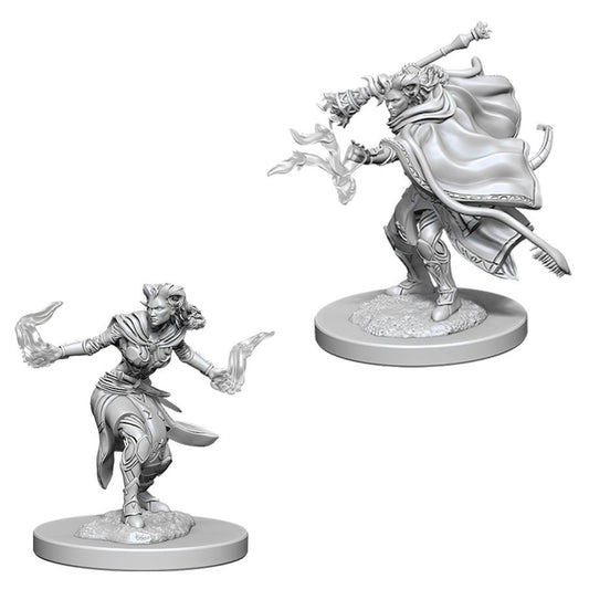 Two unpainted D&D Nolzurs Marvelous Miniatures: Female Tiefling Warlock casting, with staff and billowing cloak.
