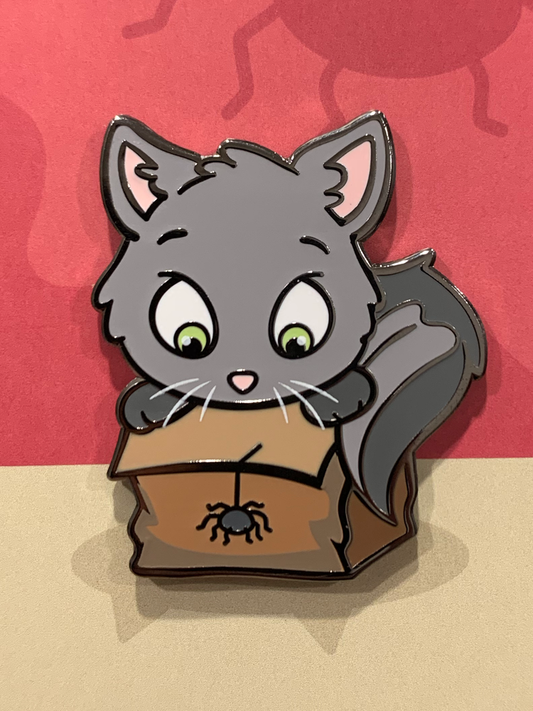 Scaredy Enamel Pin featuring a cartoon gray cat with bat wings looking at a black spider in a brown box.