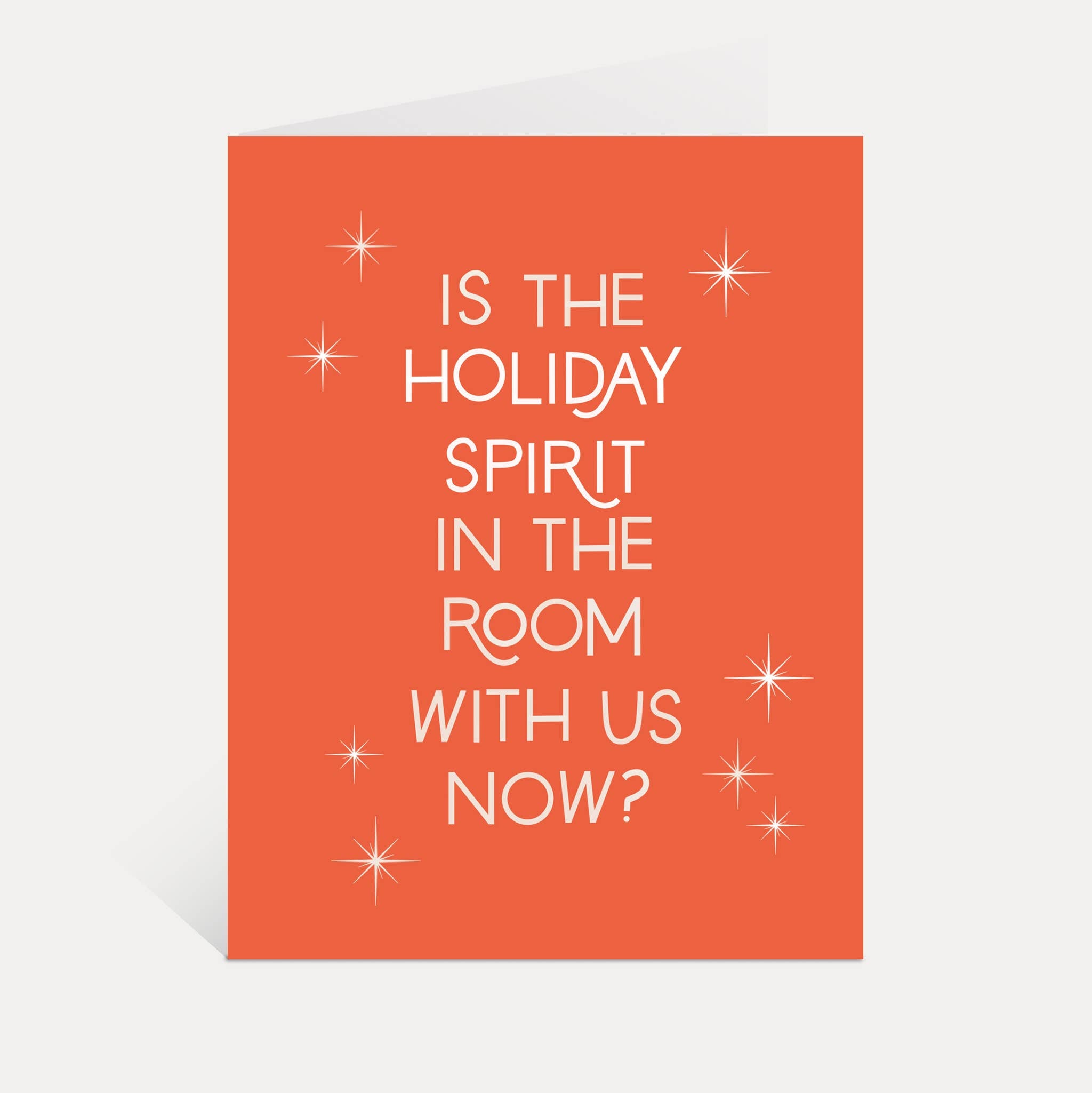 Is The Holiday Spirit In The Room With Us Now? funny card featuring a ghost on an orange background with starbursts.