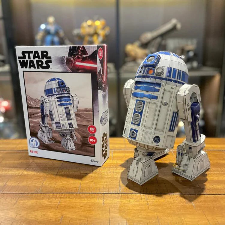 4D Star Wars Model R2-D2 displayed next to its box on a wooden surface.