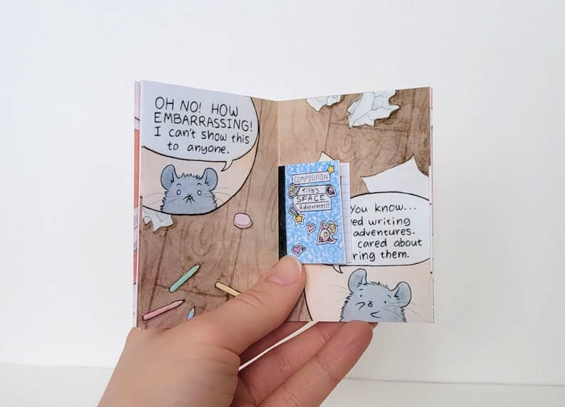 The Chinchillustrator mini-comic zine with a cover illustration of a shy gray mouse like a chinchilla held in one hand.