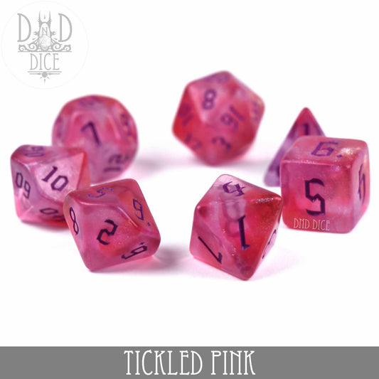 Tickled Pink 7-dice set: pink acrylic DnD dice with purple numbers on a white surface.