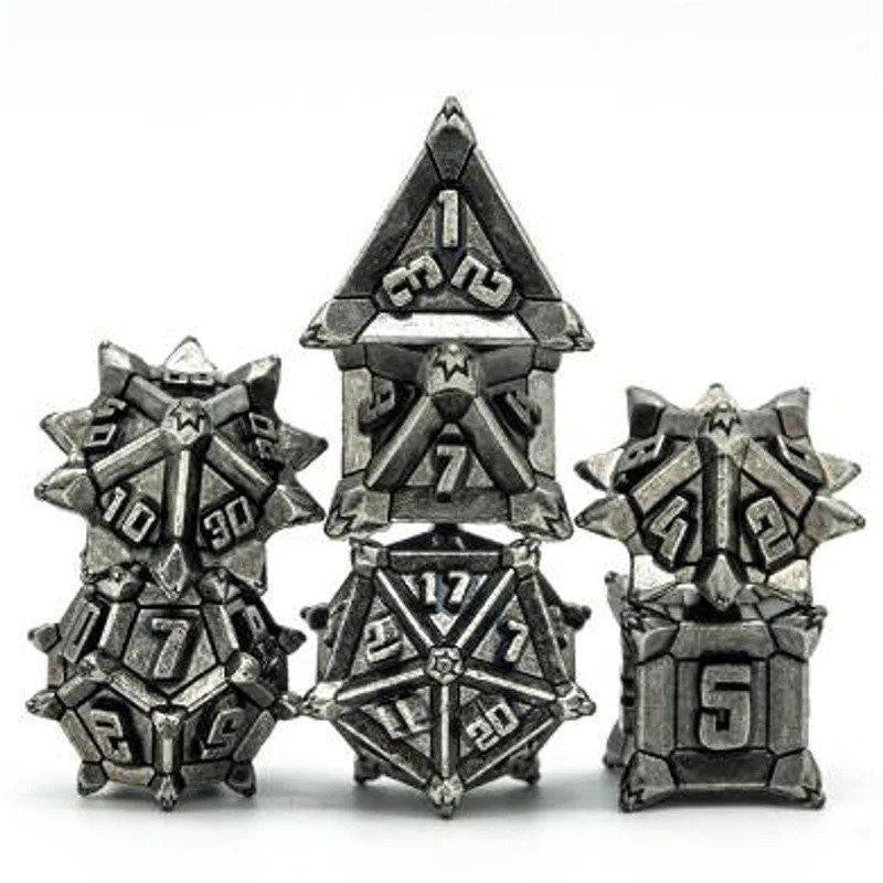Ancient Silver Flail RPG Metal Dice Set with five metallic dice in a fantasy spiked armor design.