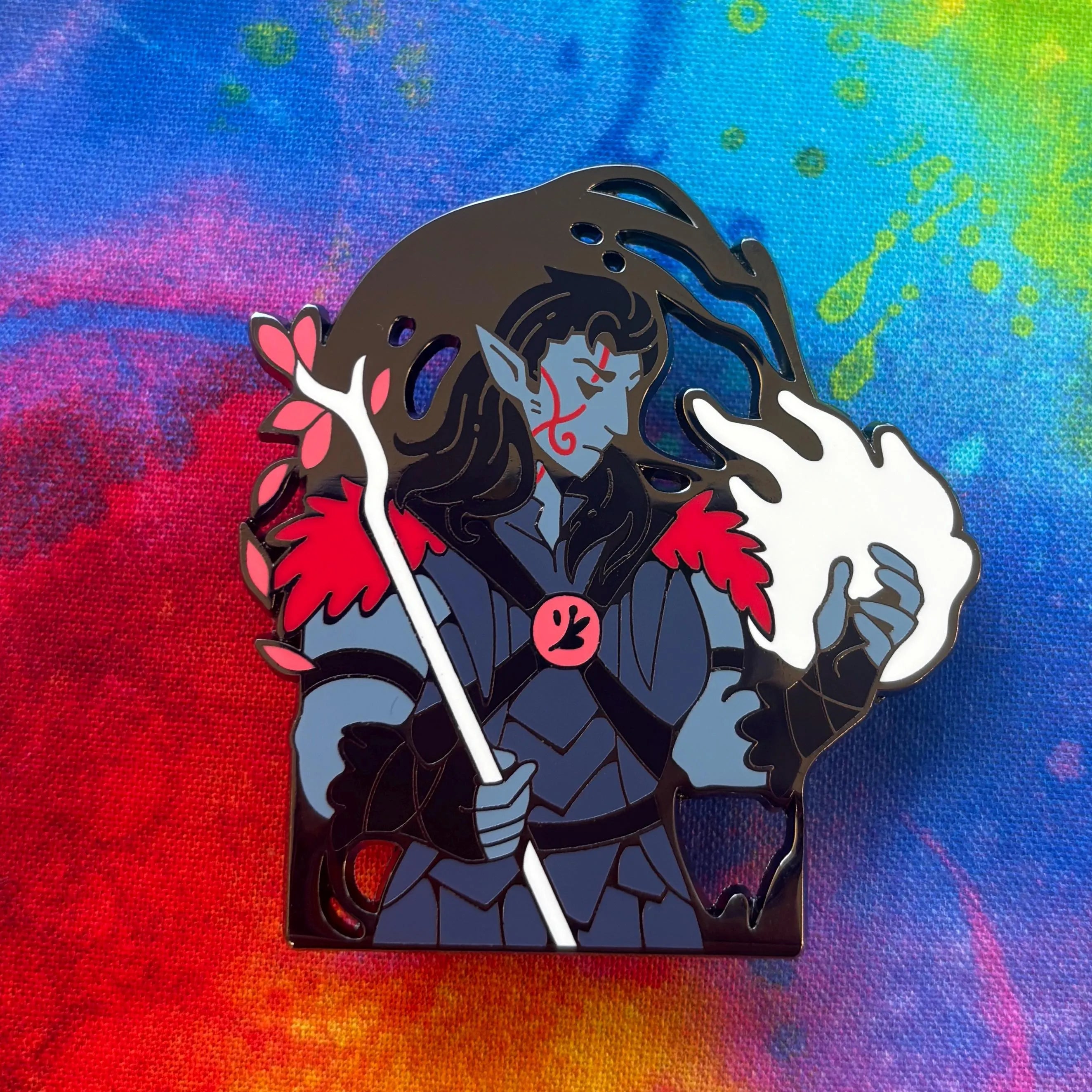 Halsin Pin showing a blue-skinned fantasy character with red markings, staff, and white flame.