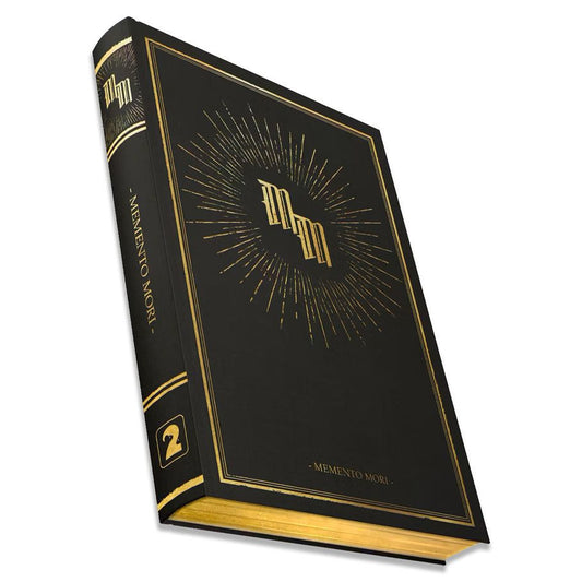 Memento Mori: Core Book, black hardcover with gold edges and a 2 on the spine; folk-horror RPG.
