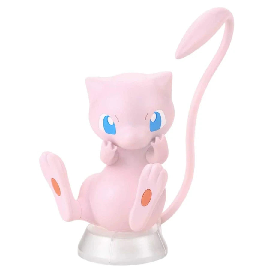 Pink Mew model kit figure with big blue eyes and long tail, assembled from colored molded Pokémon parts.