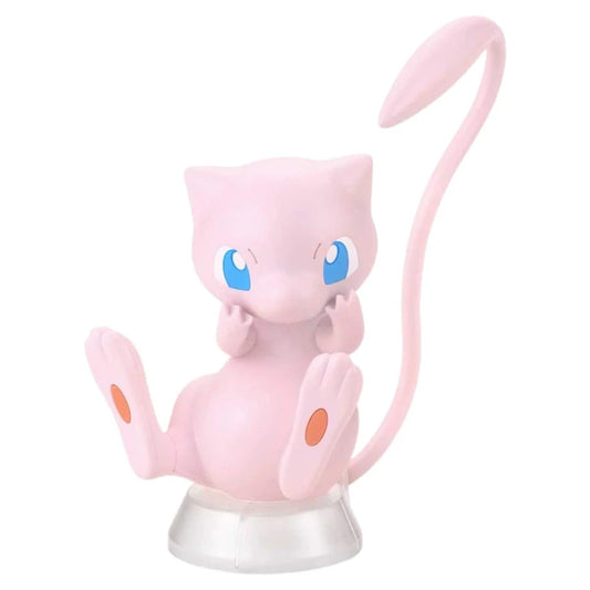 Pink Mew model kit figure with big blue eyes and long tail, assembled from colored molded Pokémon parts.