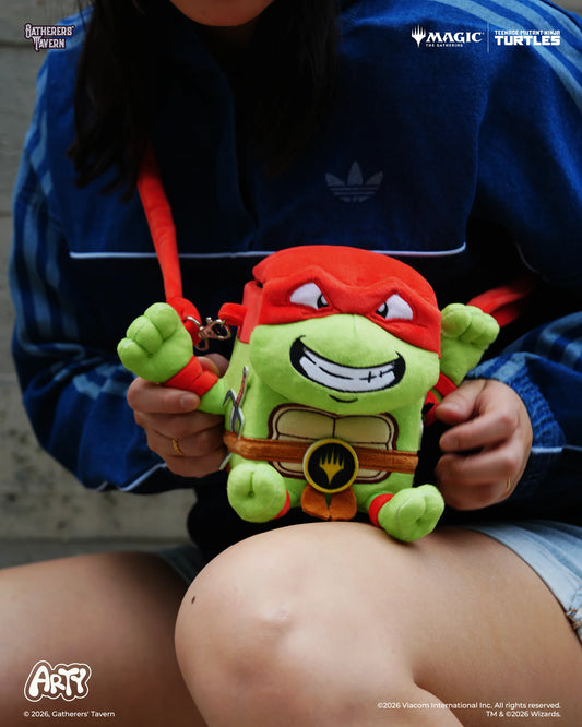 MTG ARTY Deck Box - Raphael variant with red adjustable straps, held by a person outdoors.