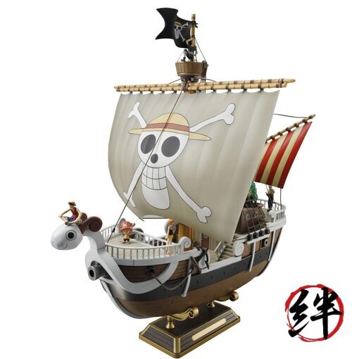 Bandai One Piece Going Merry model kit with skull sail, pirate flag, and cartoon figures.